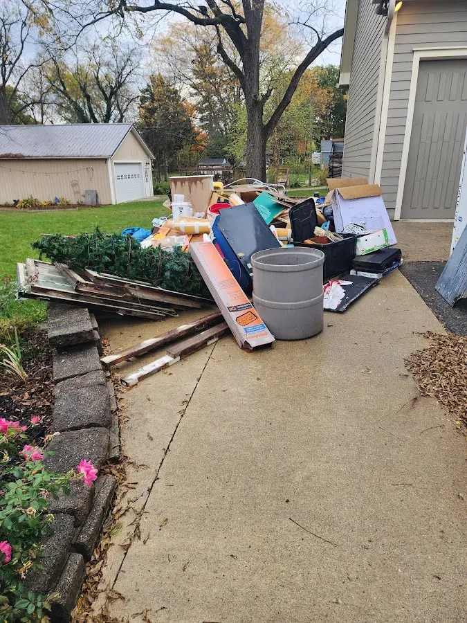 Dumpster being loaded with debris for Commercial Dumpster Rental in Ashland